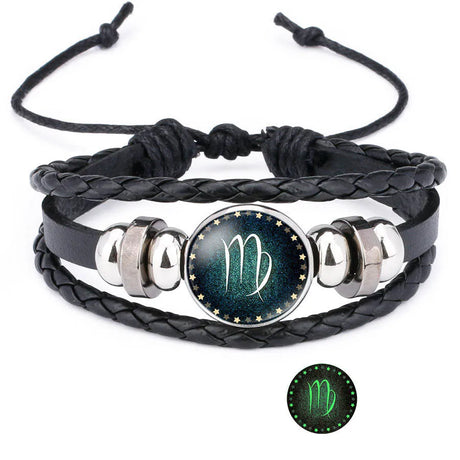 Black braided leather bracelet with silver accents and a zodiac symbol charm on a white background.