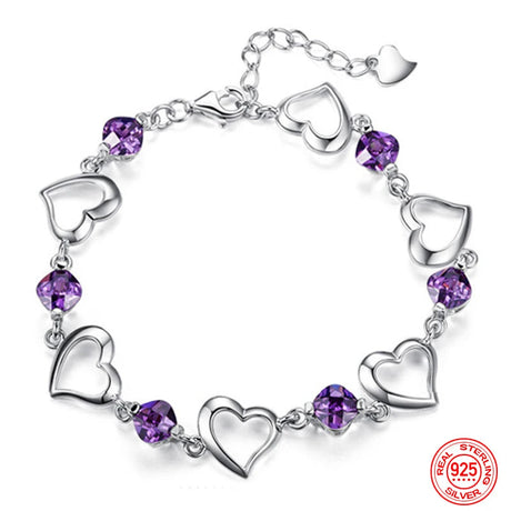 Silver bracelet with heart-shaped links and purple beads on a white background, featuring the brand 'ZDADAN'.
