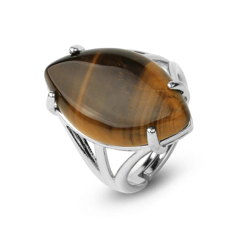 Silver ring with a large brown gemstone on a white background