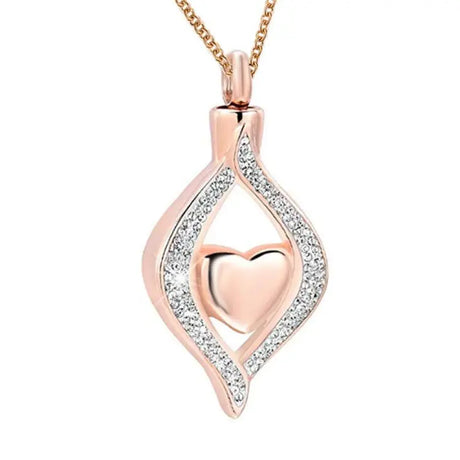 Rose gold heart-shaped pendant with clear stones on a white background