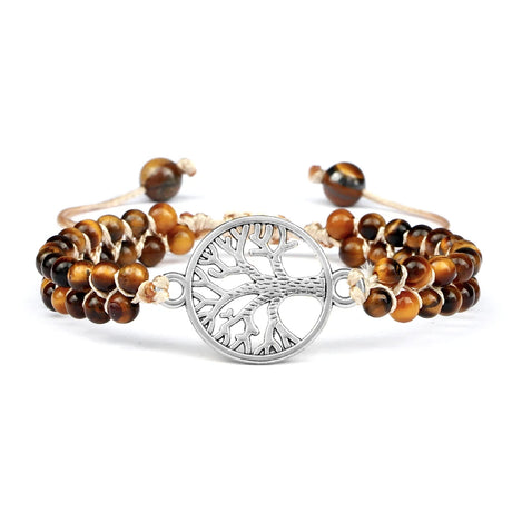 Bracelet with tree of life charm and tiger eye beads on a white background