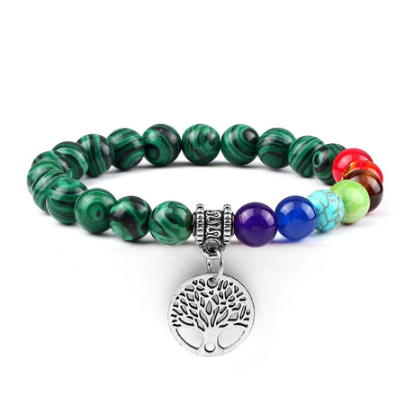 Multicolored beaded bracelet with a silver tree of life charm on a white background