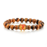 Wooden beaded bracelet with a decorative clasp on a white background