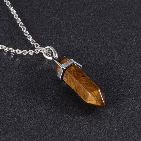 Necklace with a brown crystal pendant on a black background
