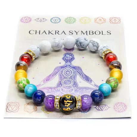 Colorful beaded bracelet on a card with chakra symbols