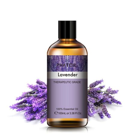 Bottle of Phat Oil Lavender essential oil with lavender flowers on a white background