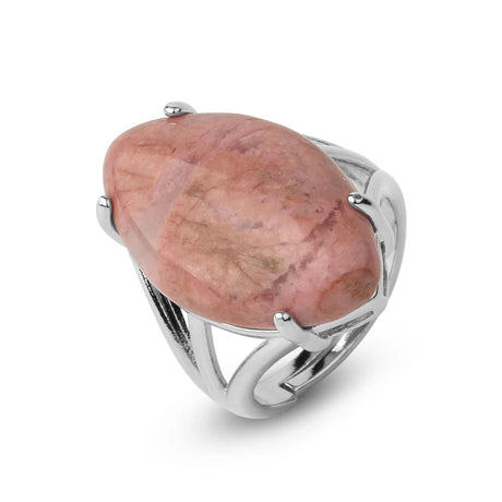Silver ring with a large pink stone on a white background