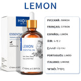 Lemon essential oil bottle with dropper and packaging on a white background