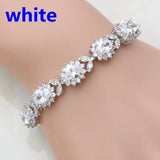 Silver bracelet with clear stones on a mannequin arm, labeled 'white'.