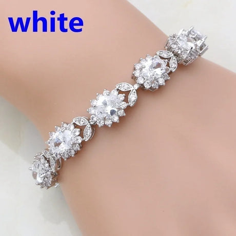 Silver bracelet with clear stones on a mannequin arm, labeled 'white'.