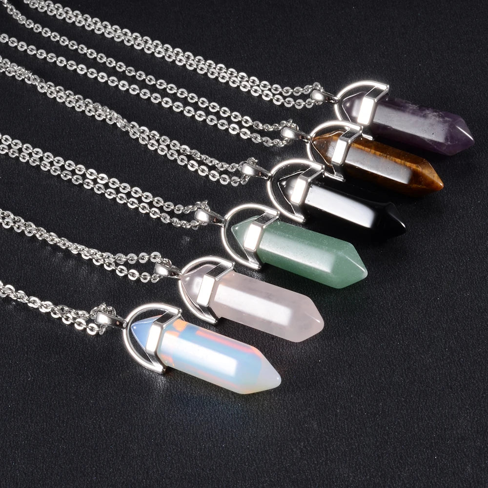 Necklaces with crystal pendants on a black background