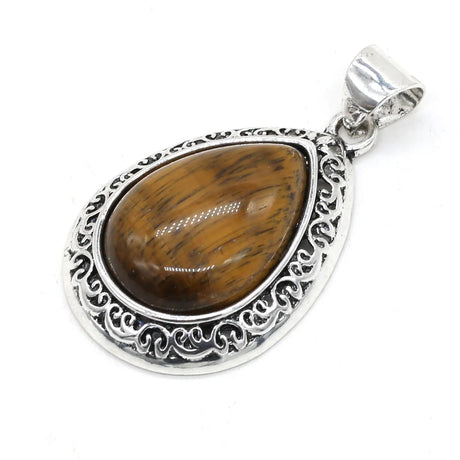 Silver pendant with a brown stone on a white background