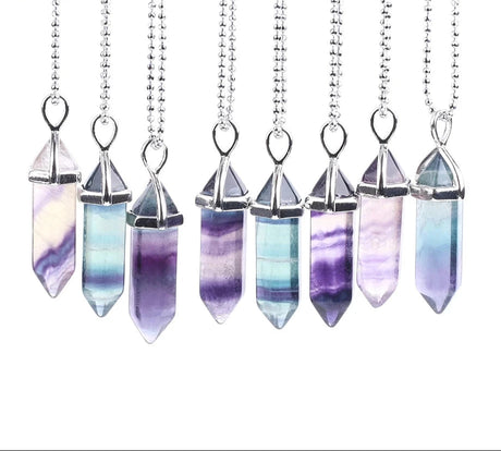 Necklaces with crystal pendants on a white background