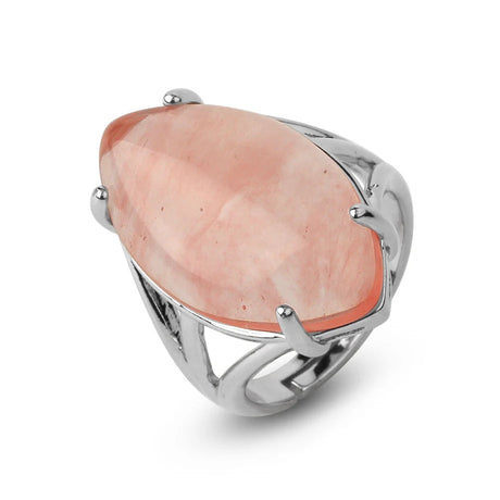 Silver ring with a large pink stone on a white background