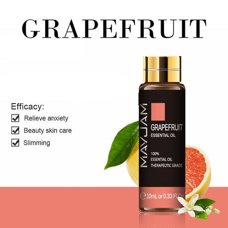Mayu Jam Grapefruit Essential Oil bottle with grapefruit slices and leaves on a white background