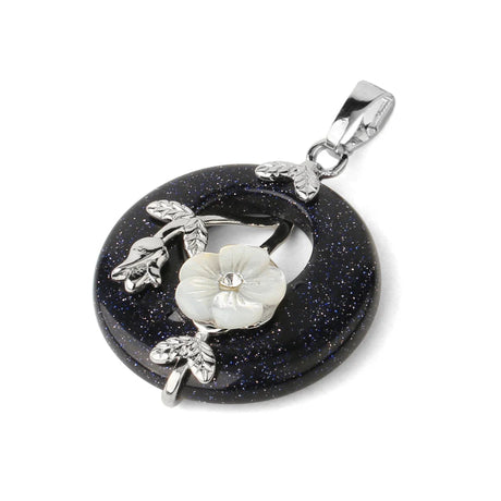 Black stone pendant with silver leaves and a white center on a white background