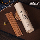 Incense stick container with incense sticks on a wooden surface
