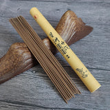 Incense sticks and their packaging on a wooden surface