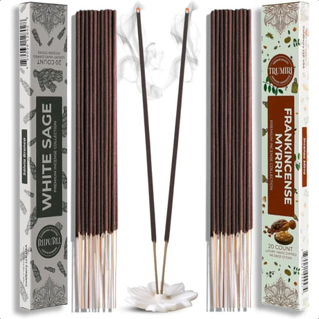 Incense sticks with their packaging labeled 'White Sage' and 'Frankincense Myrrh' on a white background.