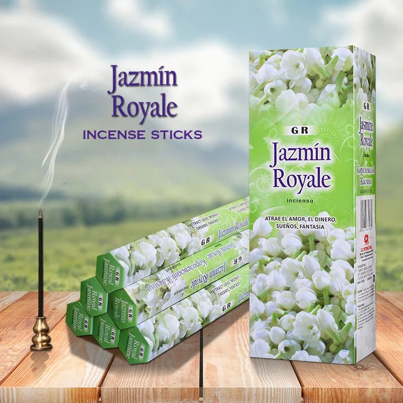 Jazmín Royale incense sticks packaging with incense stick on a wooden surface and scenic background