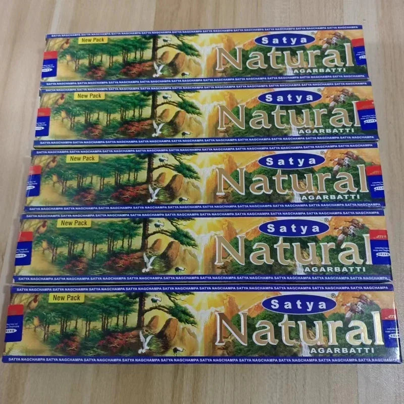 Multiple boxes of Satya Natural Agarbatti on a wooden surface