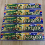 Multiple boxes of Satya Natural Agarbatti on a wooden surface