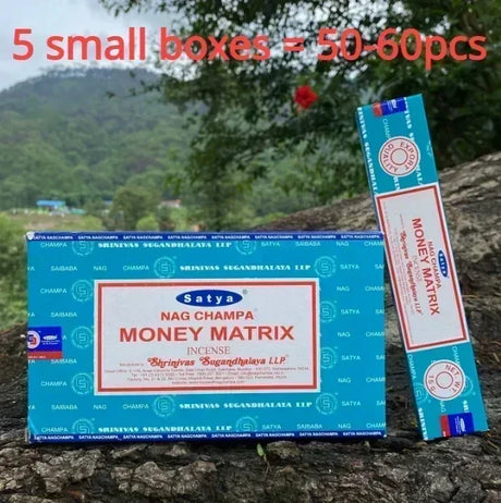 Satya Nag Champa Money Matrix incense packaging with mountainous background
