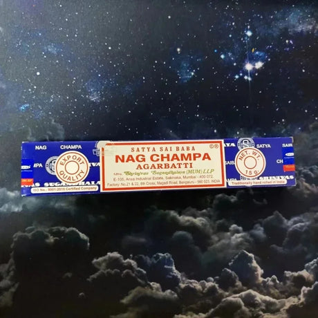 Nag Champa incense packaging against a cosmic background