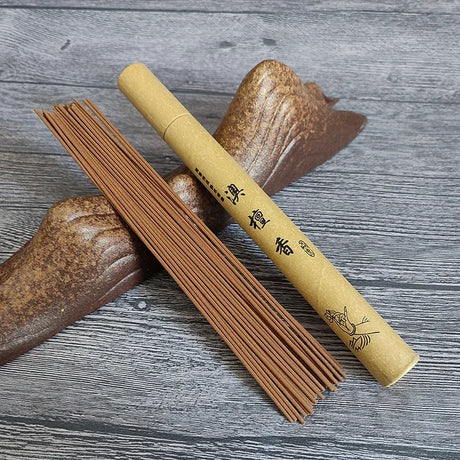Incense sticks and their packaging on a wooden surface
