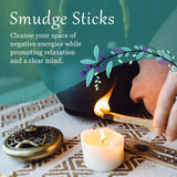 Person lighting a smudge stick with a candle, text about using smudge sticks to cleanse negative energies.