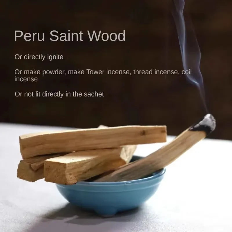 Peru Saint Wood with a match and bowl on a dark background