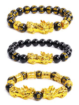 Black and gold beaded bracelets with dragon designs on a white background