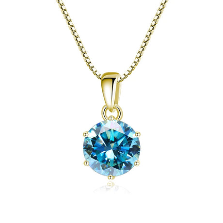 Gold necklace with a blue gemstone pendant on a white background