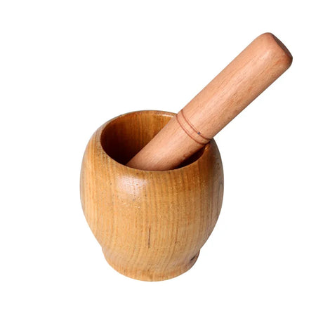 Wooden mortar and pestle on a white background