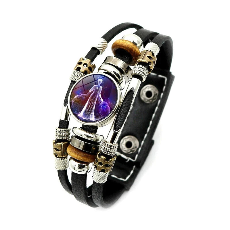 Multistrand bracelet with beads and a central purple stone on a white background