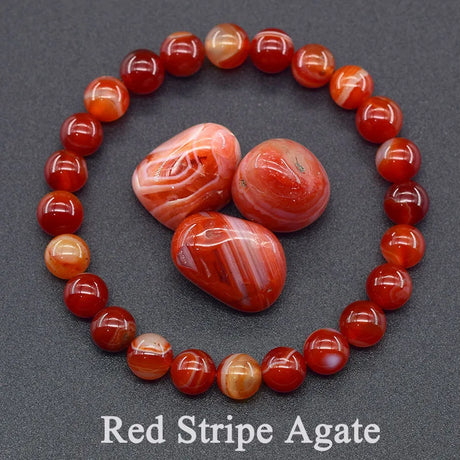 Red stripe agate beads and stones on a dark gray background with 'Red Stripe Agate' text.