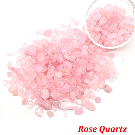 Rose Quartz stones with a bowl of stones on a white background.