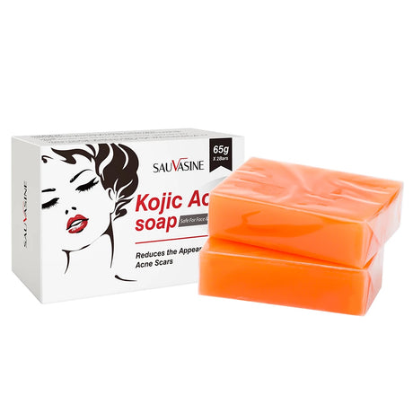 Orange soap bar with Savvasine Kojic Acid soap packaging on a white background
