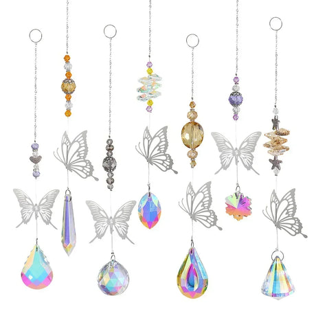 Set of hanging decorative items with butterfly and teardrop designs on a white background