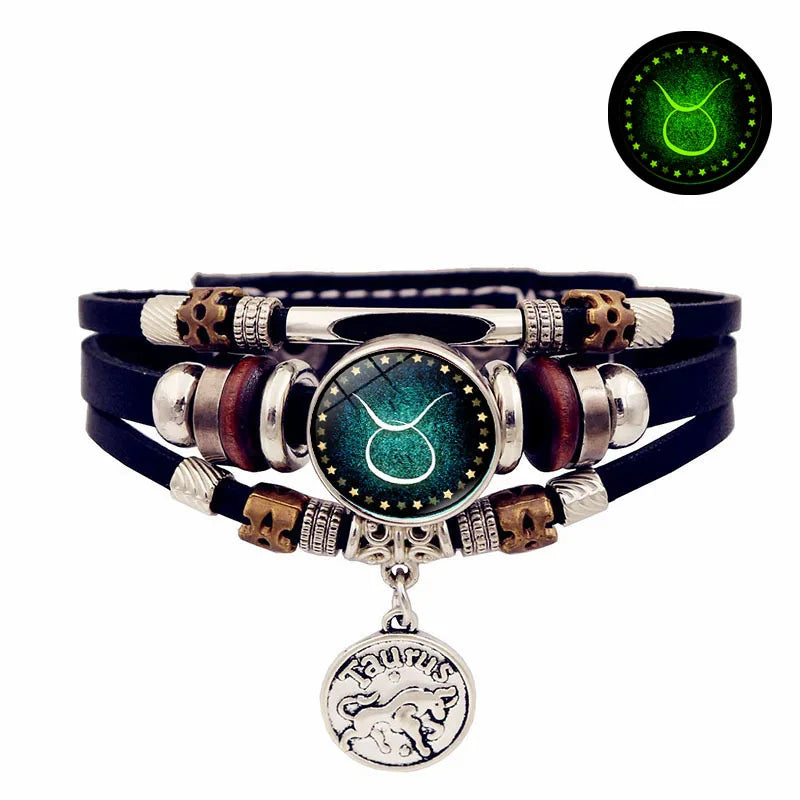 Multistrand bracelet with zodiac charm on a white background