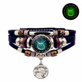 Multistrand bracelet with zodiac charm on a white background