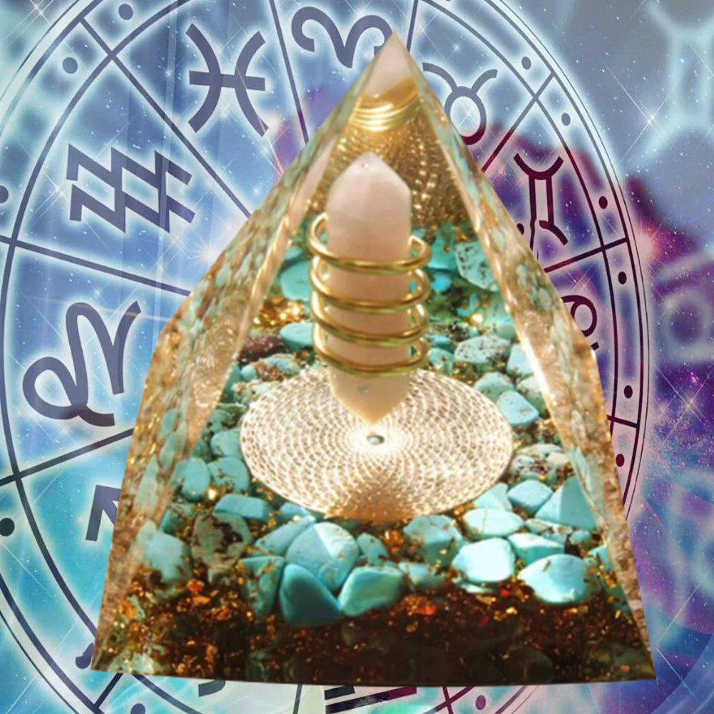 Decorative pyramid with teal stones and a light bulb on an astrological symbol background