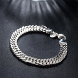 Silver chain bracelet on a dark background