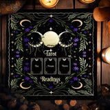 Decorative mat with tarot design featuring moon, stars, and cards on a dark background.