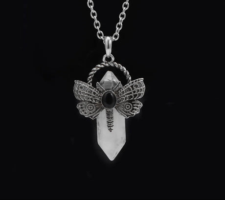 Silver pendant necklace with dragonfly design on a black background