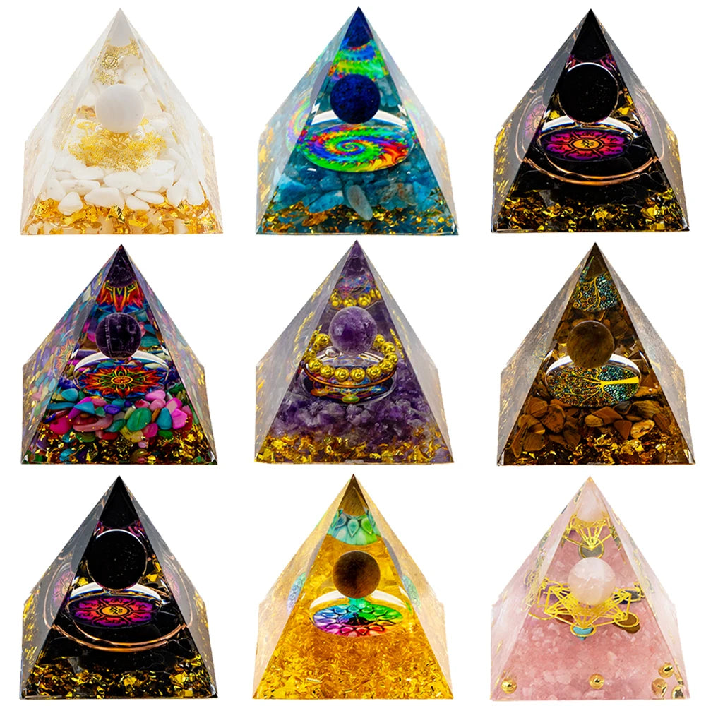 Collection of colorful pyramid-shaped orgone energy generators on a white background