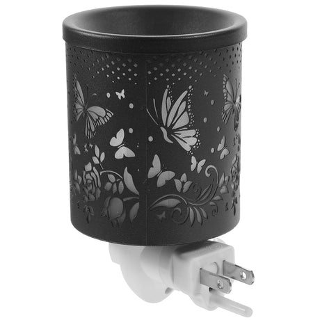 Black decorative wall plug with butterfly and floral patterns on a white background