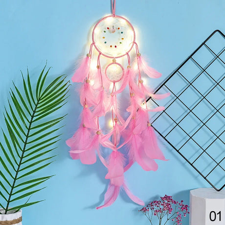 Pink dreamcatcher with lights on a blue background