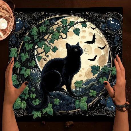 Decorative mat with a black cat design, hands holding it, and a candle on the side.