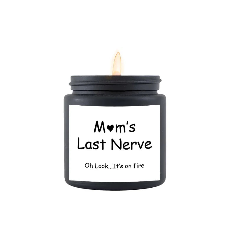 Black candle with a white label reading 'Mom's Last Nerve' on a white background